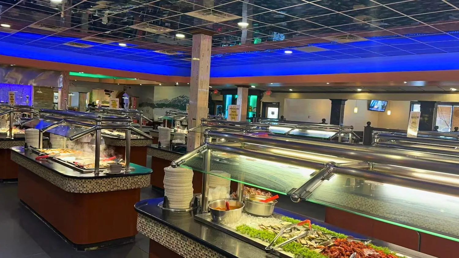 Sushi and hot food stations with glowing lighting at ICHIBAN BUFFET, a Buffet Restaurant in Leesburg.